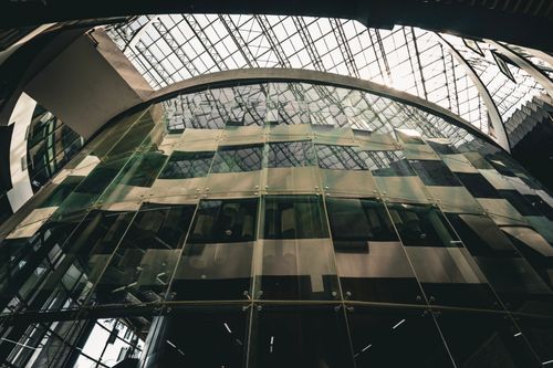 Free A striking view of modern architecture with glass facades in a Ho Chi Minh City shopping mall. Stock Photo