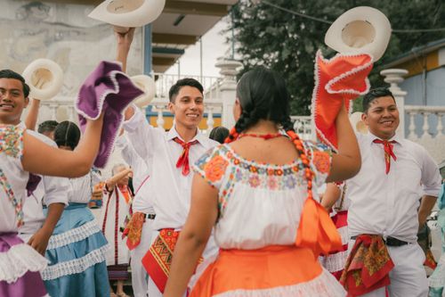 Free Vibrant scene of traditional Mexican dancers with colorful costumes in Oaxaca, Mexico. Stock Photo