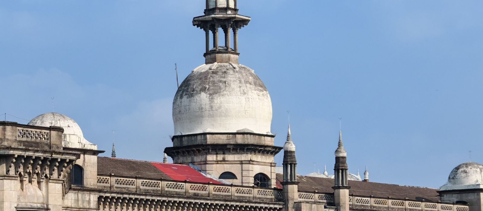 A historic domed building under a blue sky