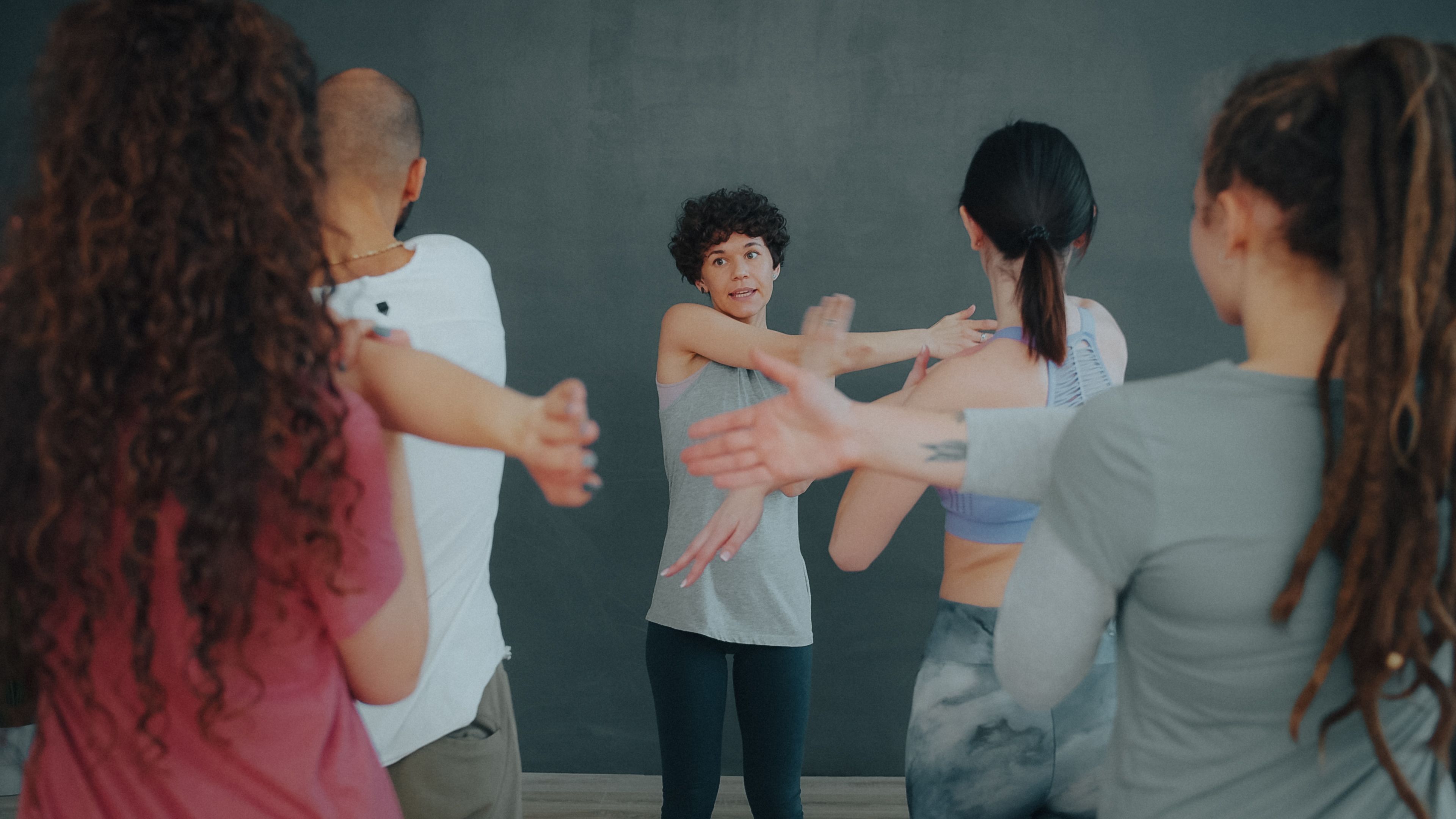 Group fitness class participants exercising together