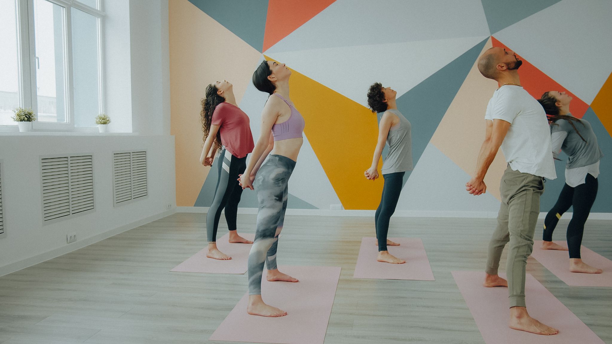 Yoga class in a bright studio