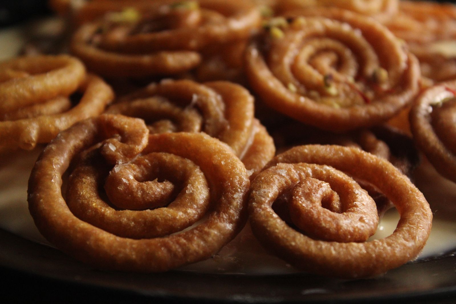 Close-up of golden spiral jalebi