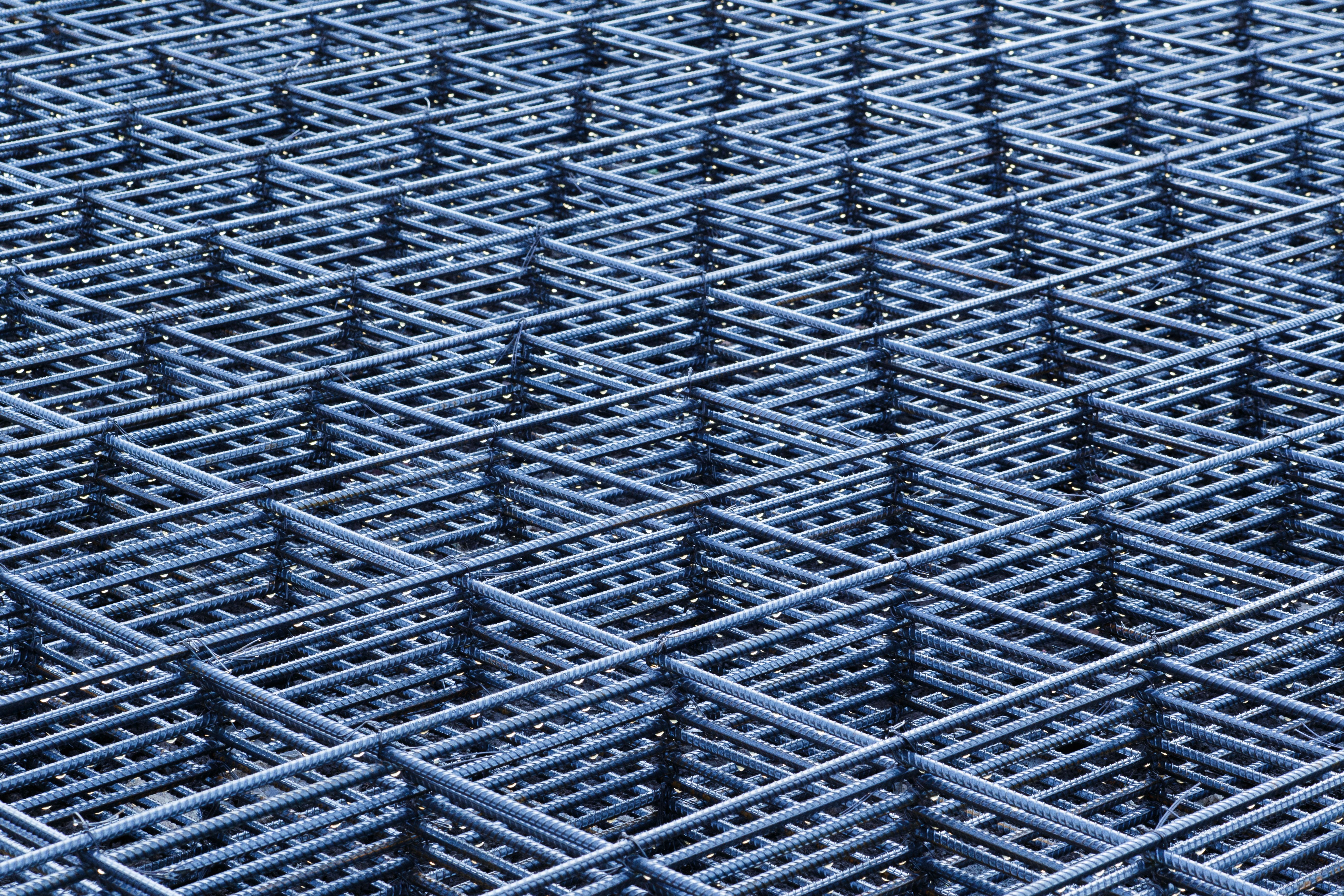 A close-up of a steel rebar grid. The bar number is its diameter in eighths of an inch.
