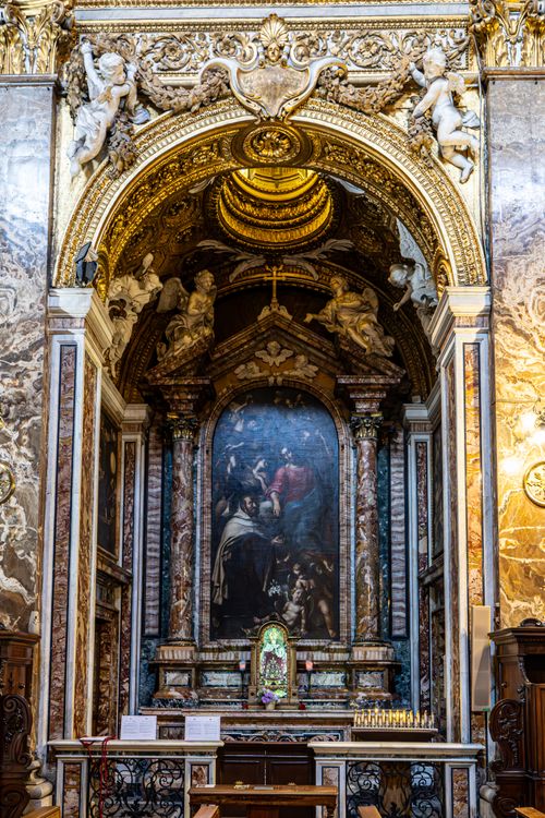 Free Detailed view of a Baroque altar in a Roman church, showcasing intricate carvings and religious artwork. Stock Photo