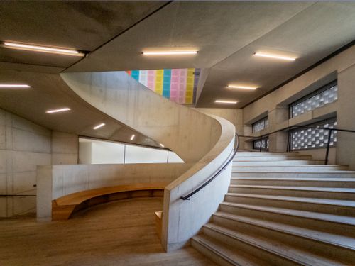 Free Explore modern brutalist architecture with a striking spiral staircase in an art gallery setting. Stock Photo
