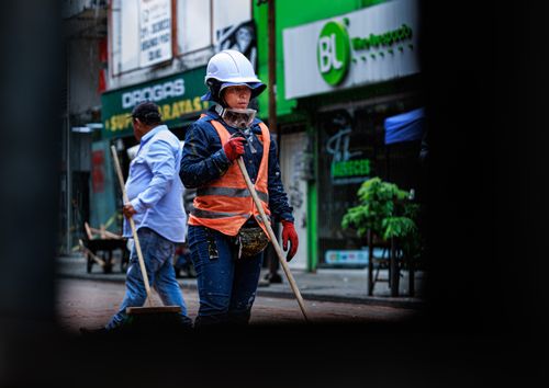 Free Construction workers wear protective gear while working on city streets in Pereira, Colombia. Stock Photo