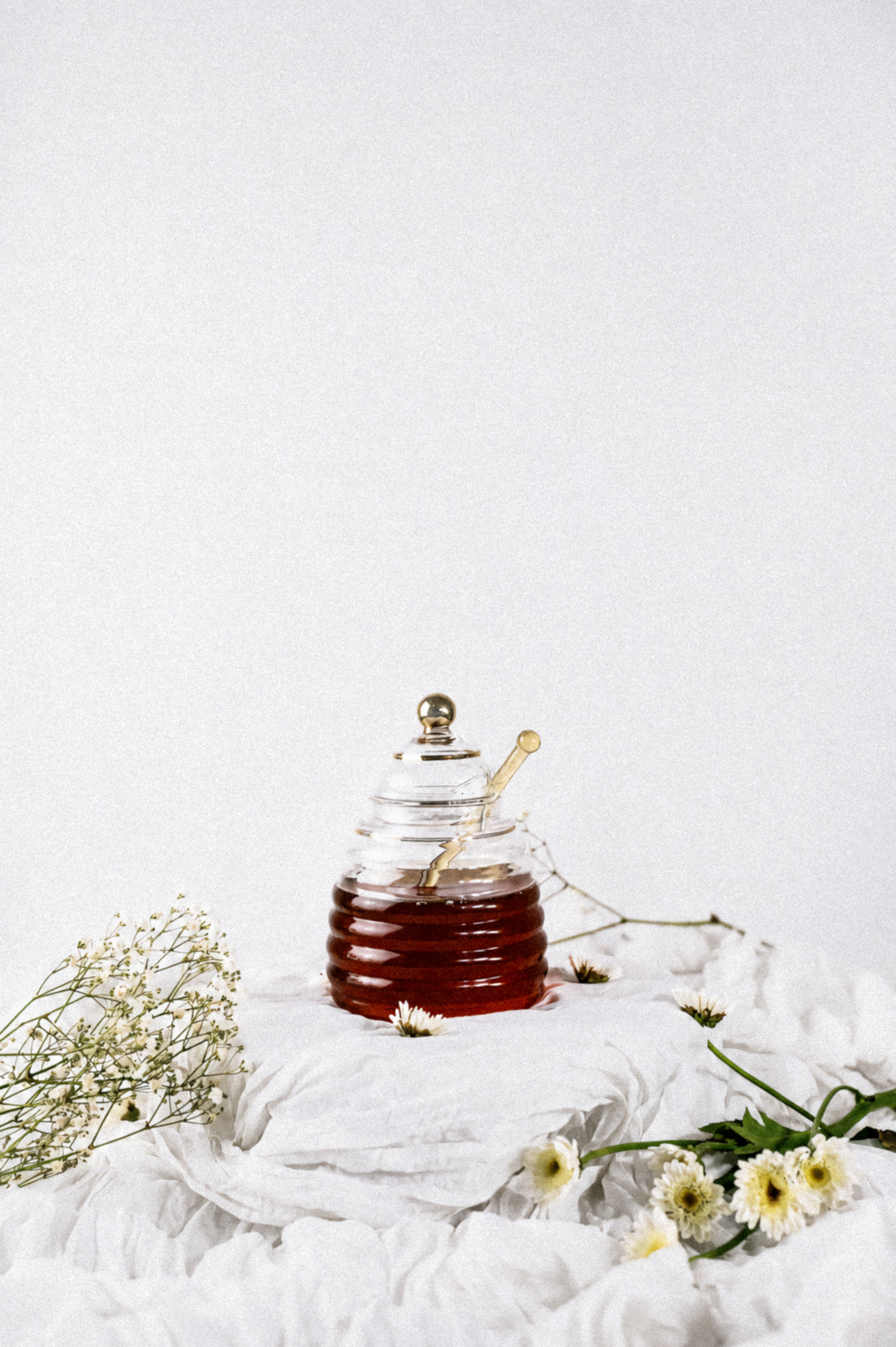 Honey jar with wildflowers