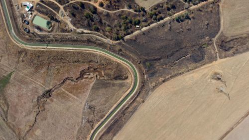 Free Aerial image showing a winding road through rural terrain in KZN, South Africa. Stock Photo