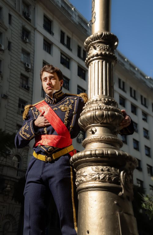 Free Man in historical military costume posed against classic Buenos Aires architecture. Stock Photo
