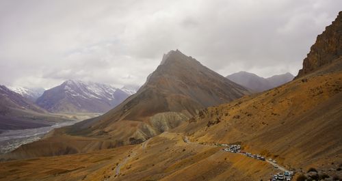 Free Stunning view of rugged mountains and winding roads in Ladakh, under cloudy skies. Stock Photo
