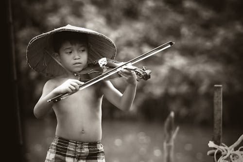 2354: Free Grayscale Photography of Boy Playing Violin Stock Photo