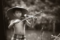 Grayscale Photography of Boy Playing Violin