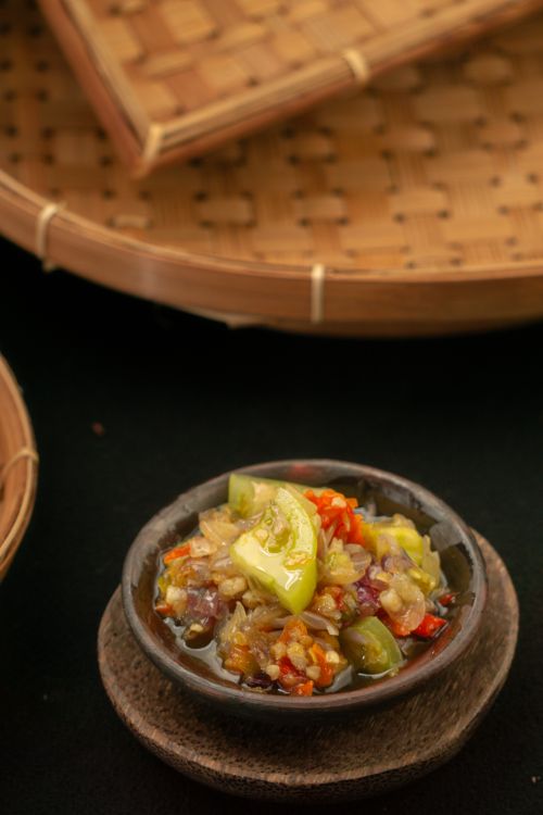 Free A bowl of traditional Indonesian sambal with vibrant ingredients, captured in Jakarta, Indonesia. Stock Photo