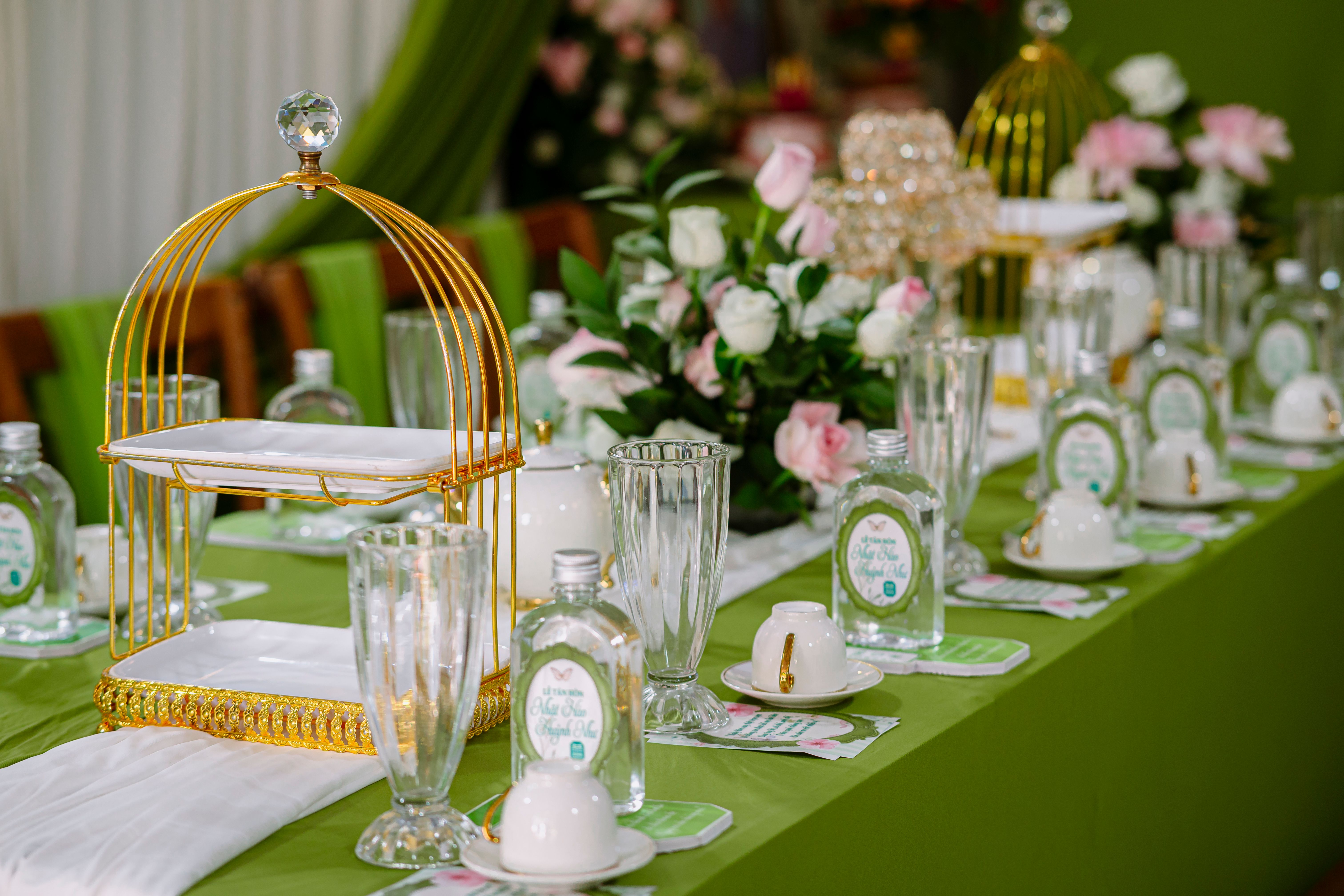 A beautifully arranged table with floral decor and elegant dishware in a sophisticated dining setting.