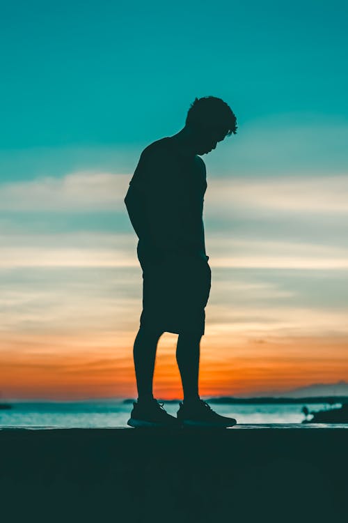 Silhouette Photo of Man During Dawn