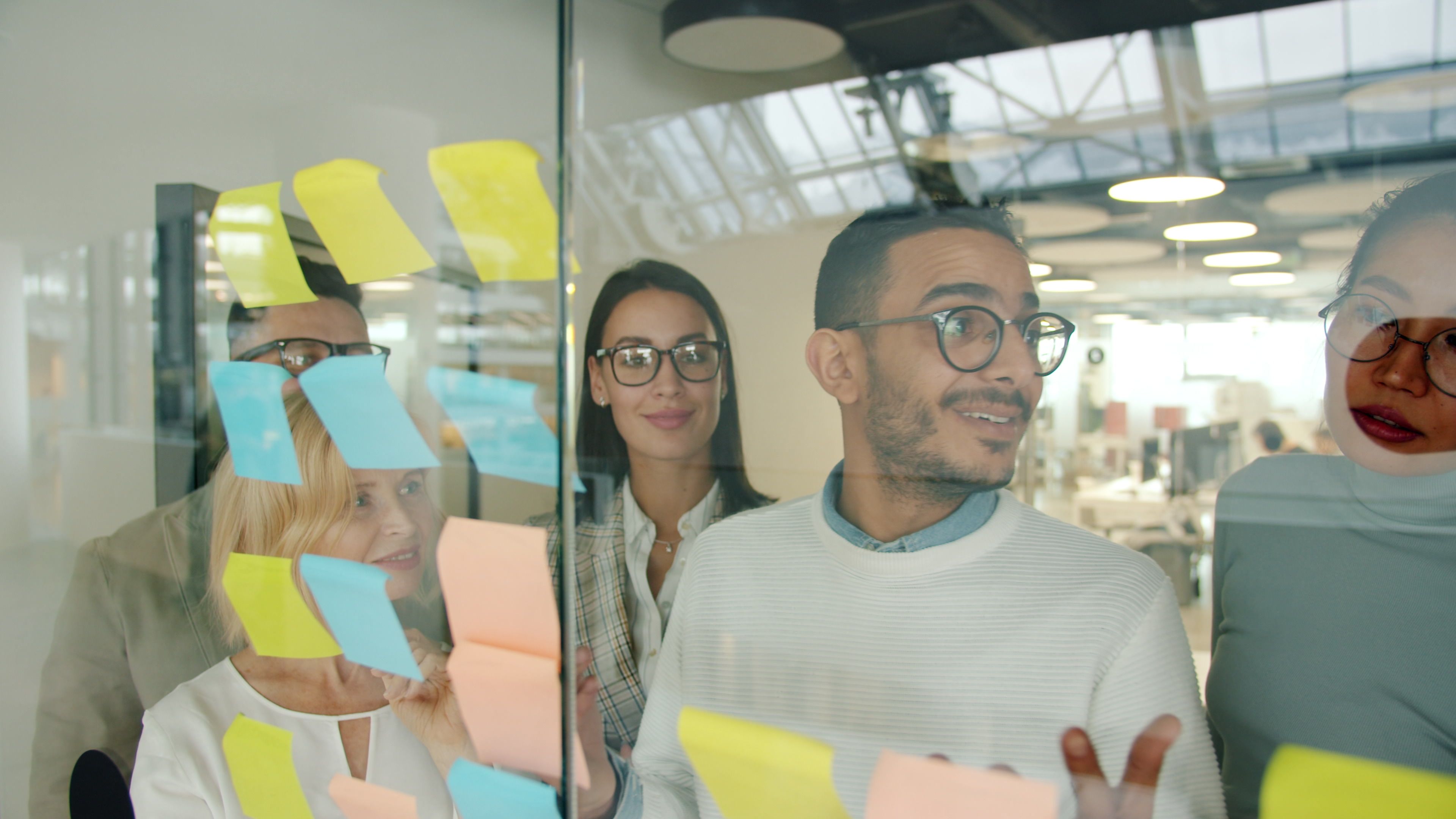 sticky notes arranged on a wall during a planning session