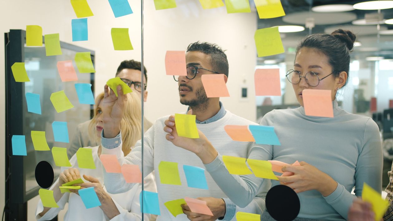 Team brainstorming with sticky notes