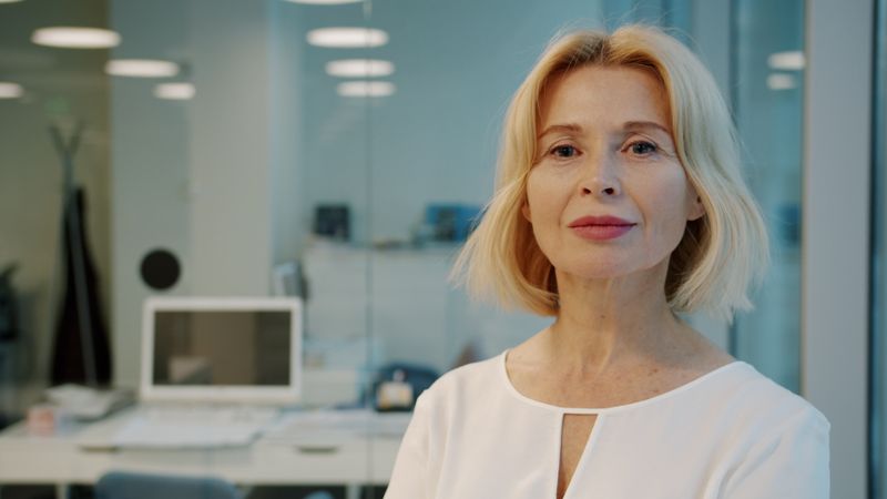 Portrait of a confident middle-aged businesswoman in a modern office setting