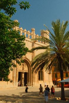 A vibrant day at the iconic Palma de Mallorca Cathedral set against a clear sky.