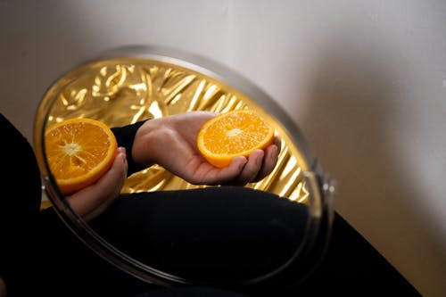 Person Holding Orange Citrus Fruit