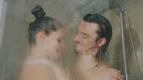 Free Romantic couple sharing a tender moment in the shower, enjoying quality time. Stock Photo