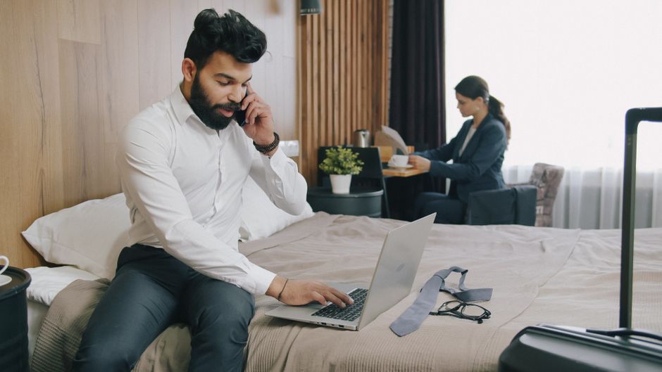 host reviewing airbnb calendar laptop
