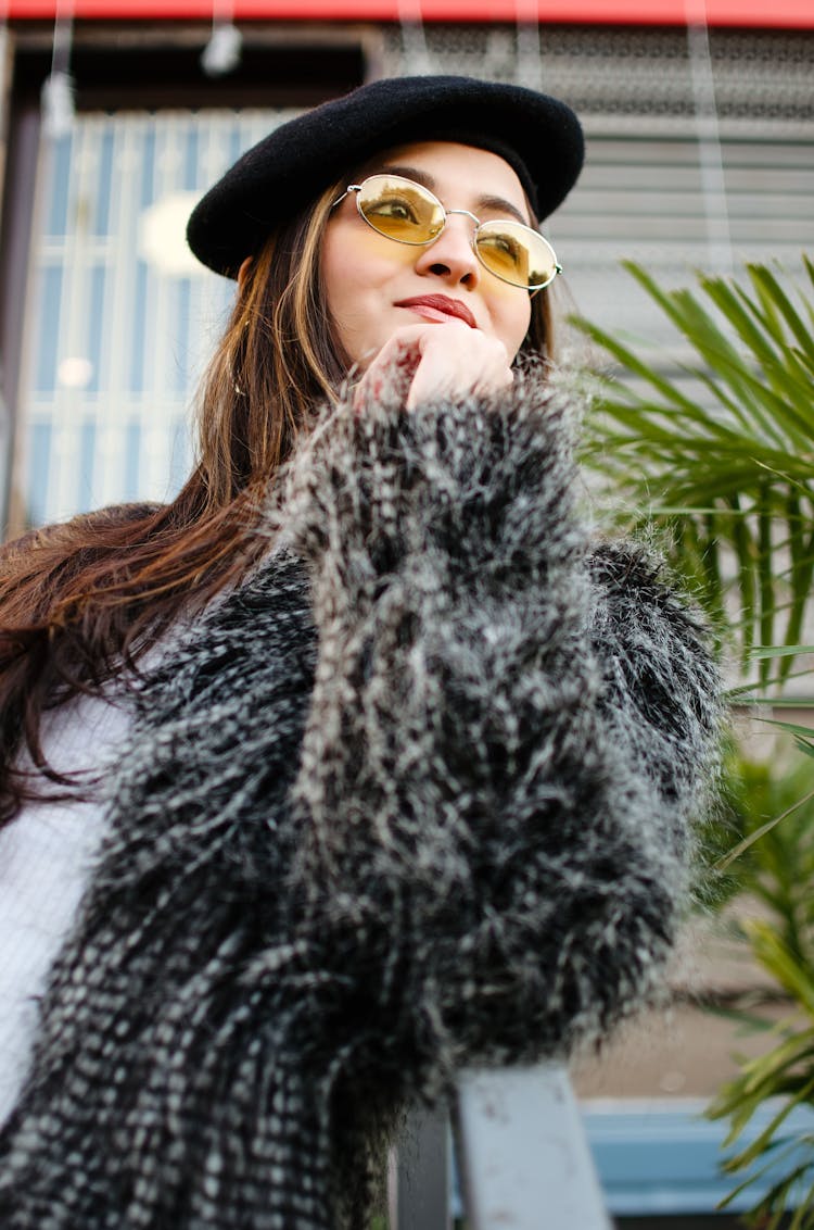 Woman In Black Fur Coat Wearing Sunglasses