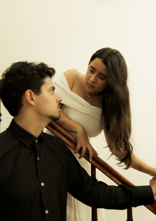 Free A stylish couple in a minimalist setting, enriching stairway with elegance and grace. Stock Photo