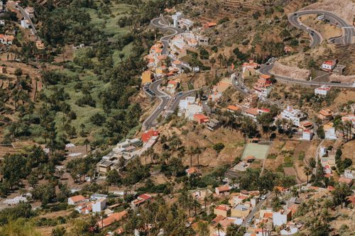 Free A picturesque aerial view of Valle Gran Rey's terraced fields and village houses in the Canary Islands, Spain. Stock Photo