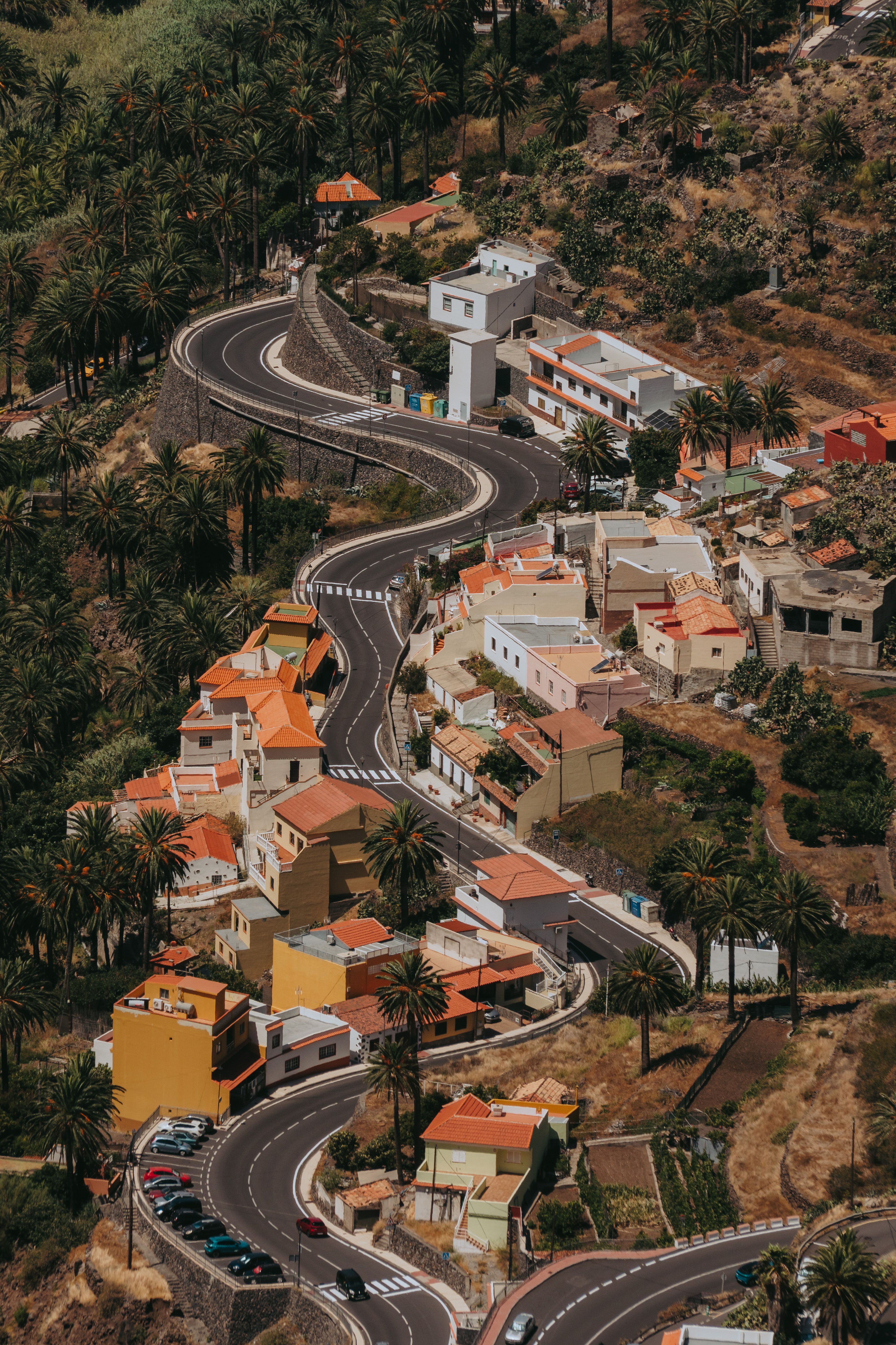 Aerial view of winding roads and colorful houses in Valle Gran Rey, Canary Islands.
