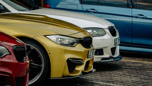 Free Close-up shot of luxury cars parked side by side in eMalahleni, showcasing vibrant car colors. Stock Photo