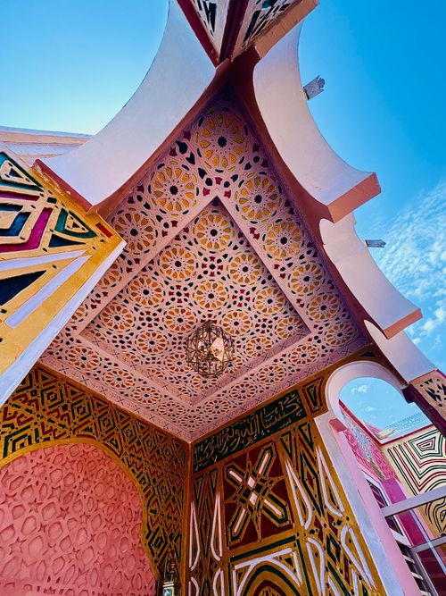 Free Stunning vibrant ceiling featuring intricate patterns and vibrant colors in Nigerian architecture. Stock Photo