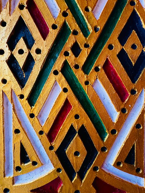 Free Vibrant geometric wall art featuring traditional Nigerian designs and vivid colors. Stock Photo