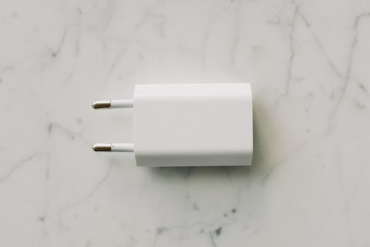 White Adapter On White Surface