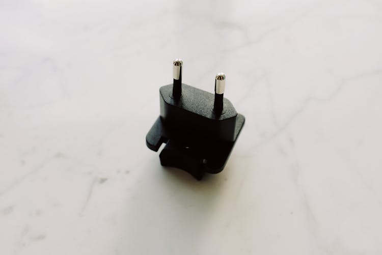 Black Adapter On White Surface