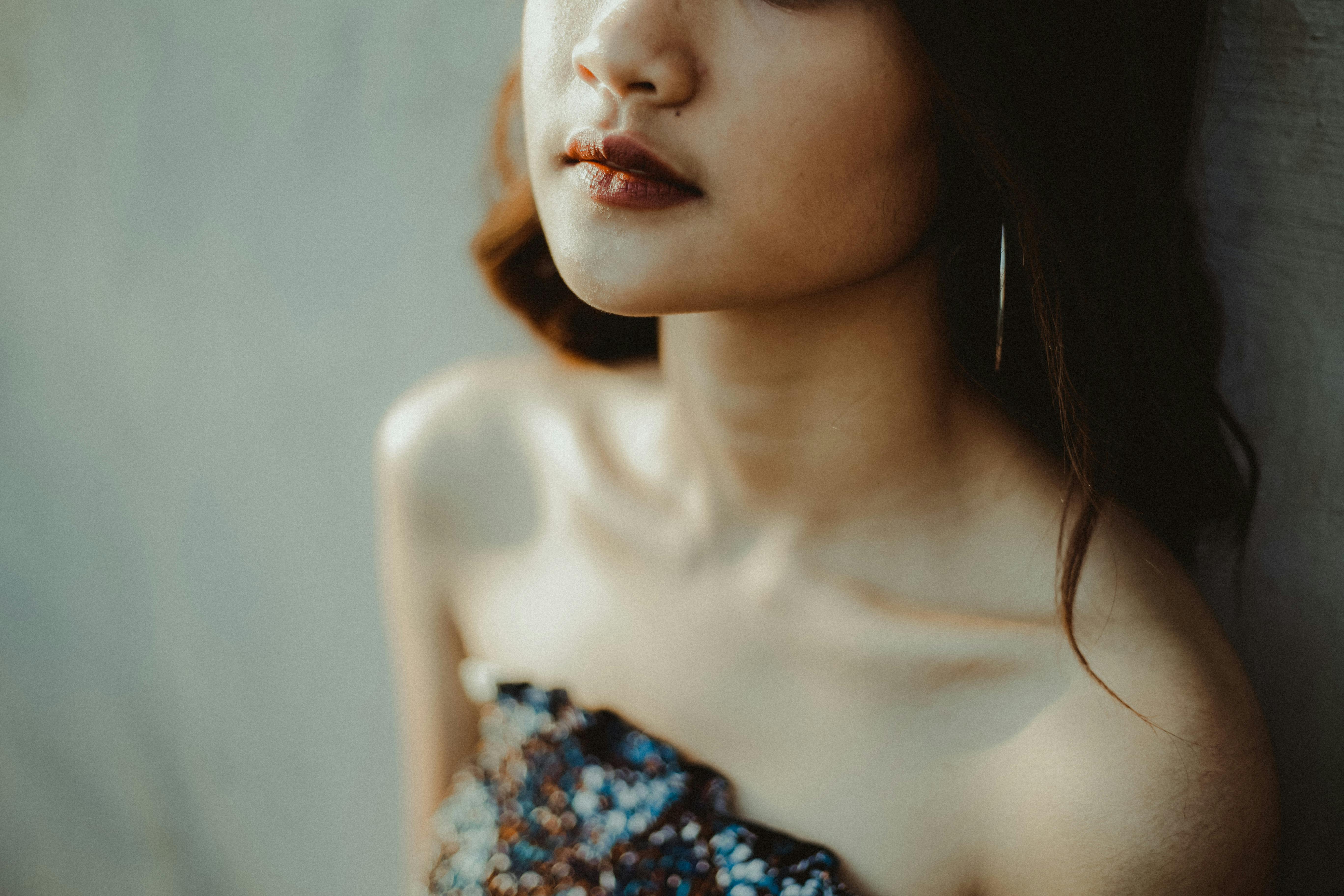 woman in blue and white floral tube top