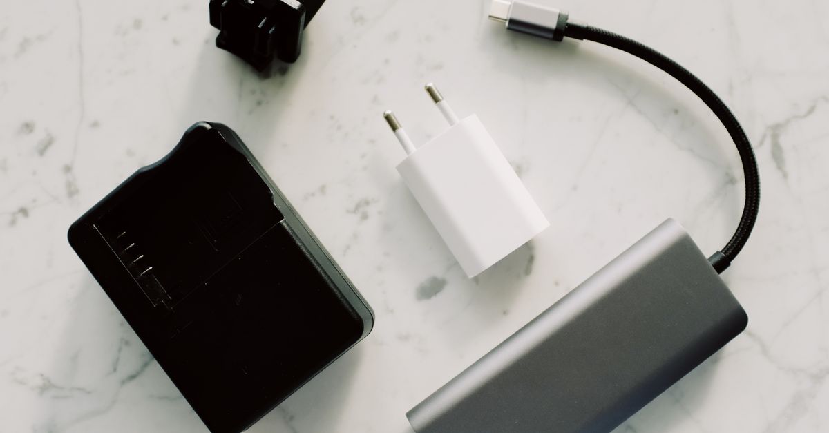 Photo Of Power Bank Near Socket · Free Stock Photo