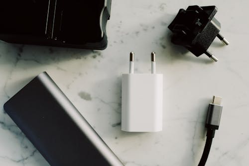 Free Adapters On White Surface Stock Photo