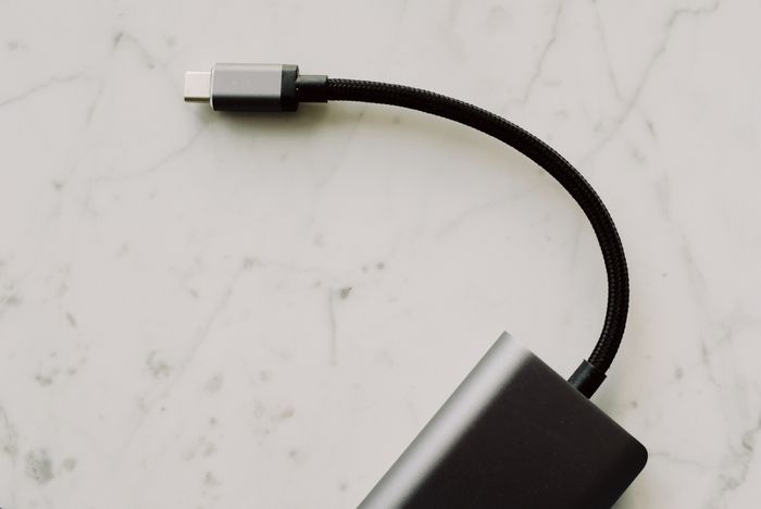 USB-C cable and connector on a marble surface