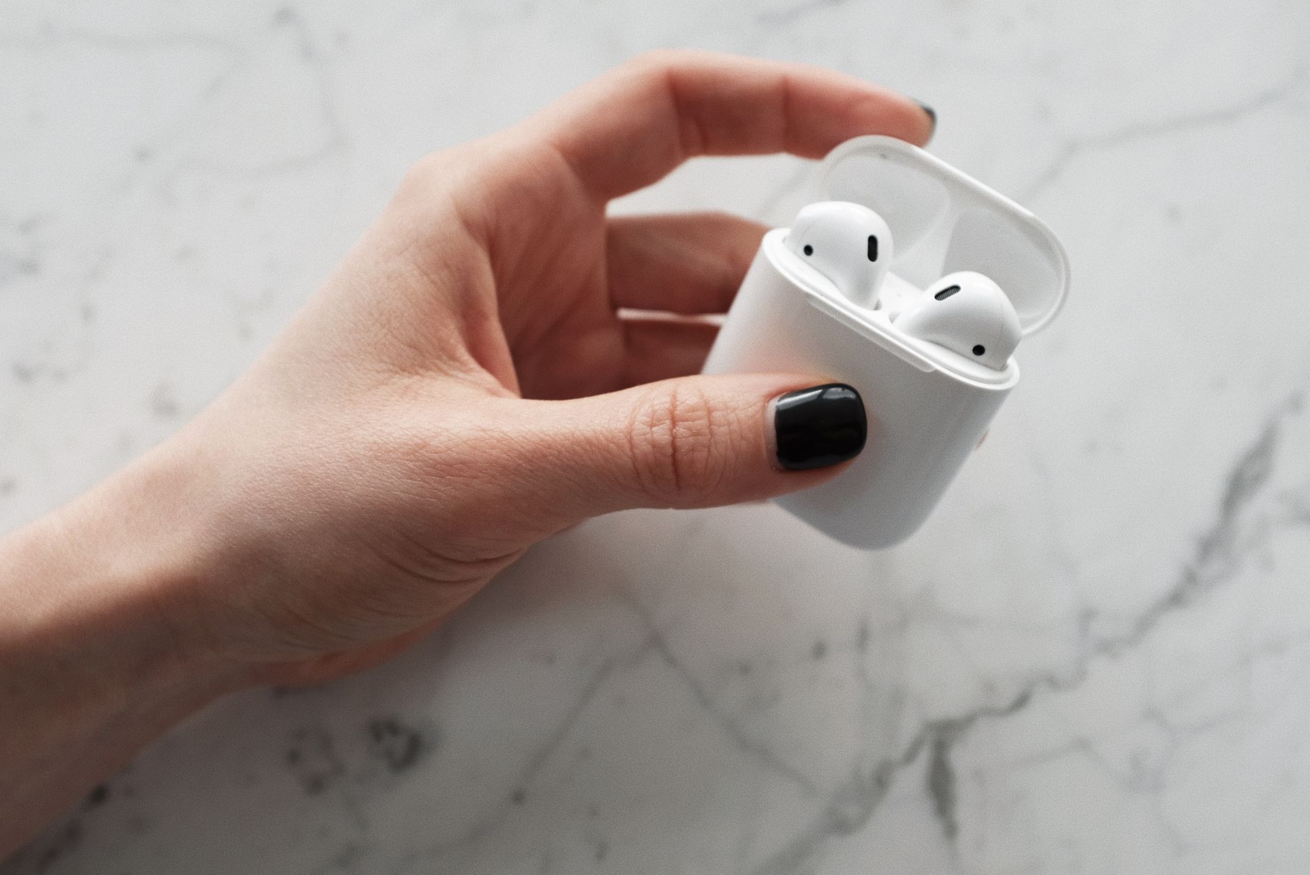 Wireless earbuds in their charging case