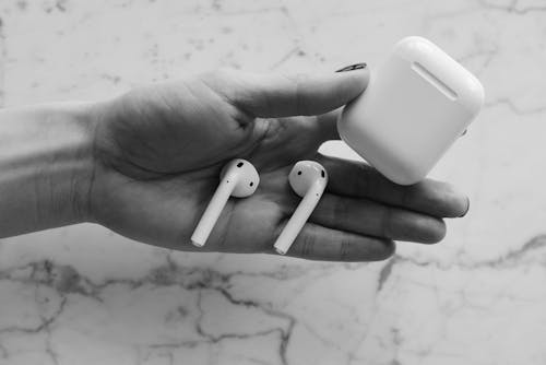 Free Person Holding White Apple Airpods Stock Photo