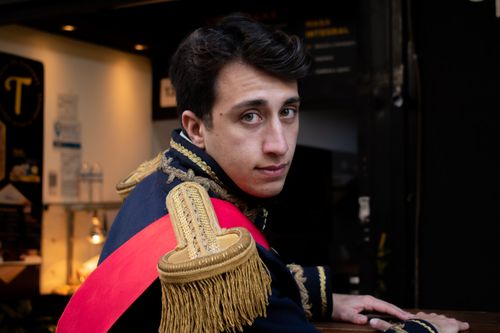 Free Portrait of a young man in a historic military costume indoors. Stock Photo