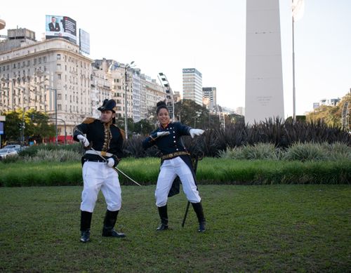 Free Two guards in historic costumes pose in front of the iconic Buenos Aires Obelisk. Stock Photo