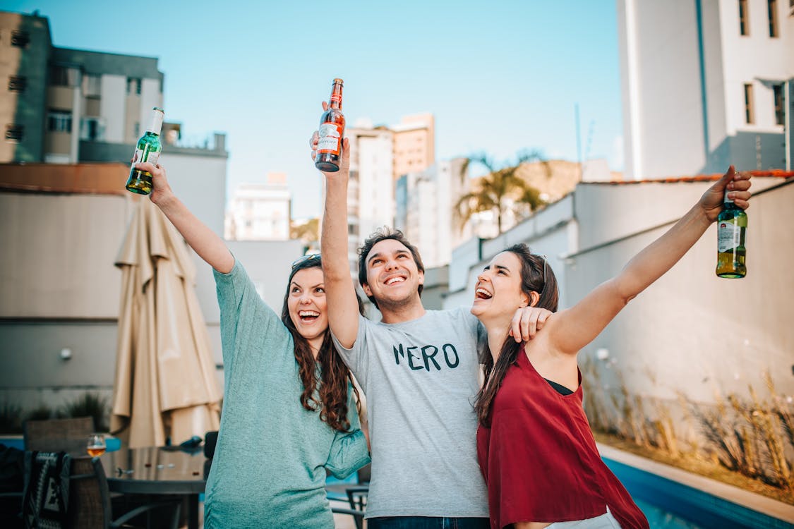 Free Friends Holding Bottles Of Beer Stock Photo