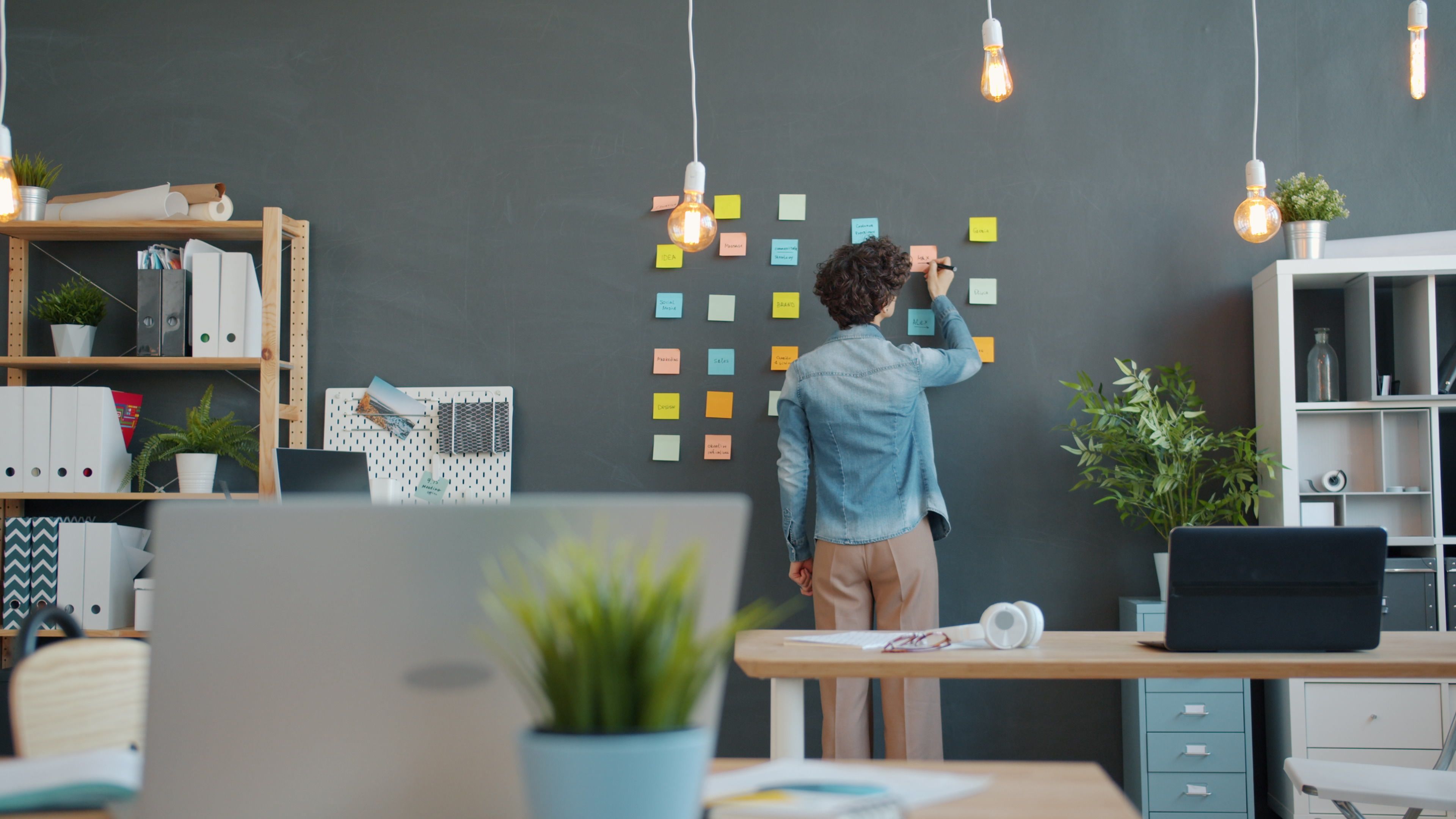 Brainstorming session with sticky notes on modern surface