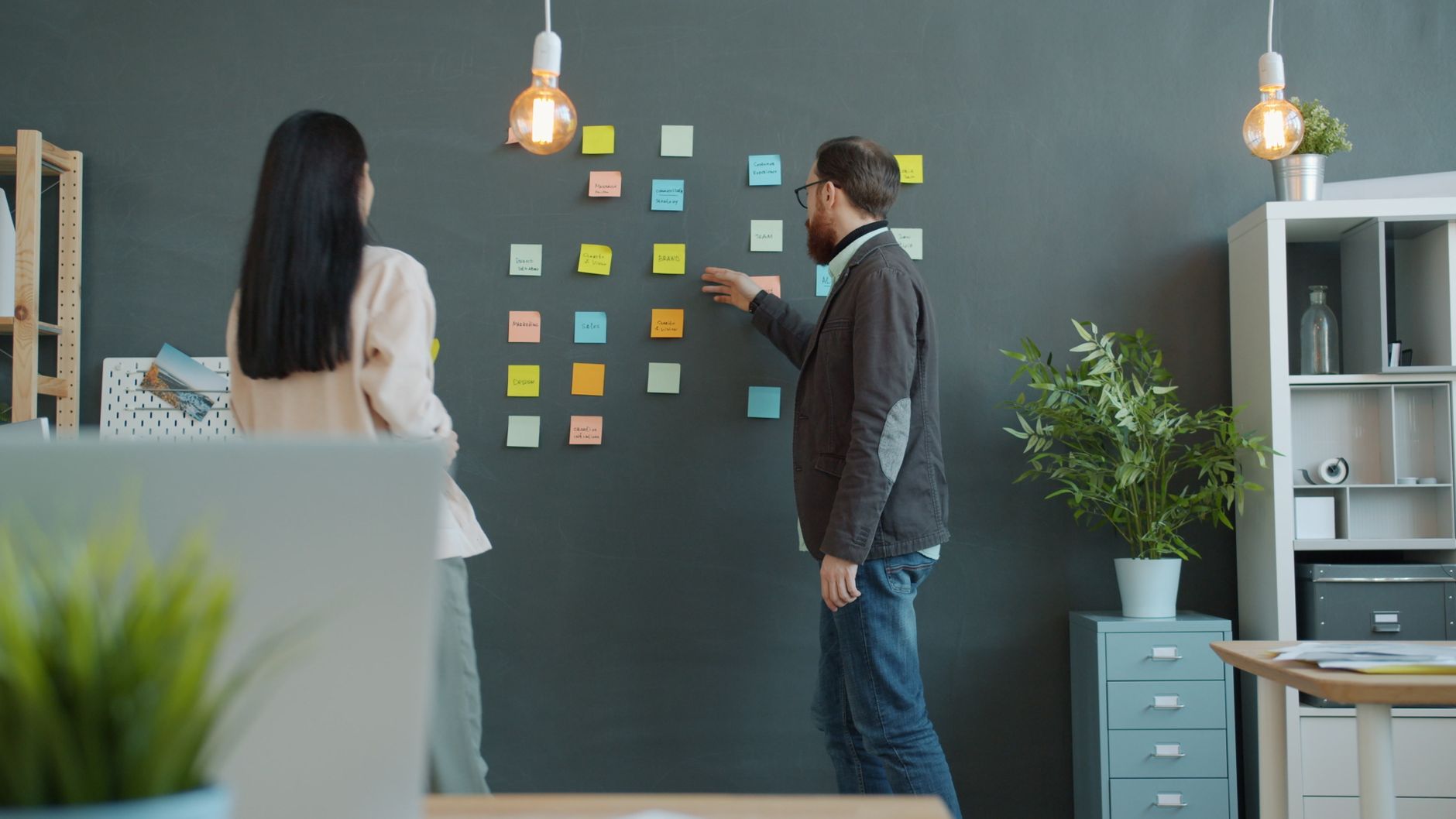 Sticky notes arranged on a wall as part of a planning session