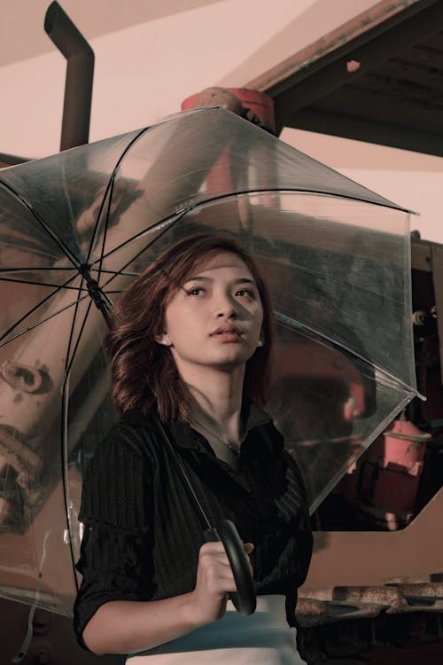 Photo of Woman Holding Umbrella