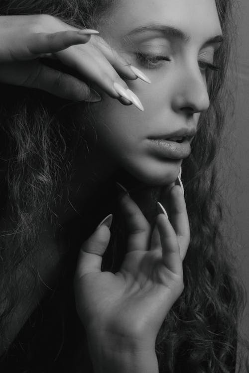 Free Grayscale Photo Of Woman With Hands On Her Face Stock Photo