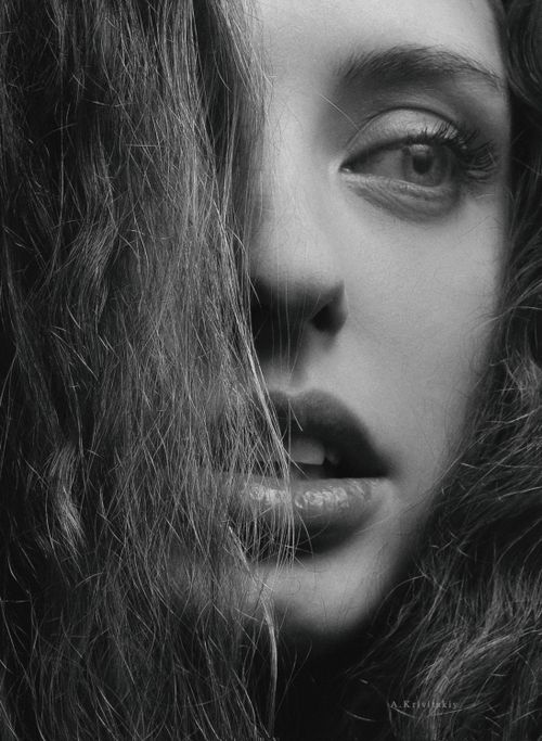 Free Black and white close-up portrait of a woman with an expressive gaze. Stock Photo