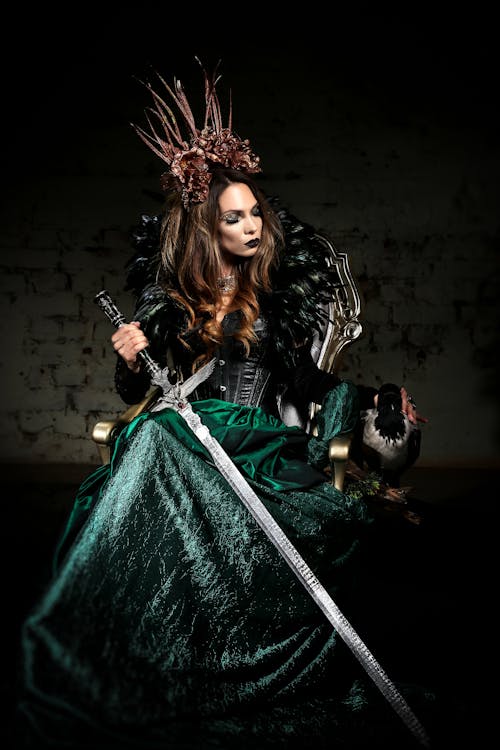 Woman Wearing A Costume Holding A Sword